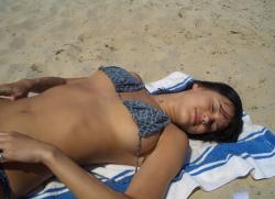 Cute brunette topless on the beach 2/11
