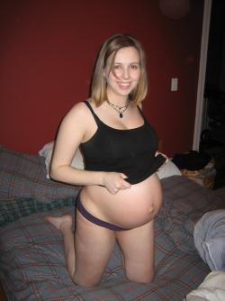 Cute pregnant blonde posing 9/20