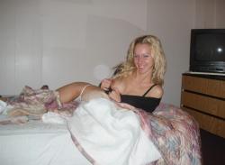 Blonde girl showing naked pussy on bed 5/19