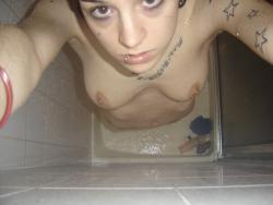 Tatooed young naked girl 19/34