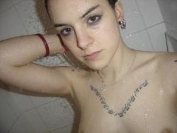 Tatooed young naked girl 20/34