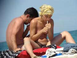 Nudist girl smoke on the beach 4/50