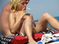 Nudist girl smoke on the beach 11/50
