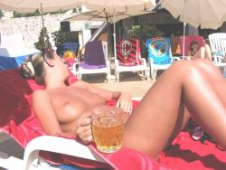 Nudist woman take a drink 16/43