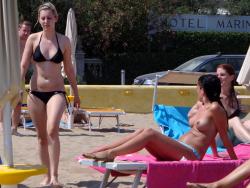 Girls sunbathing on italian beach of the adriatic coast 7/12