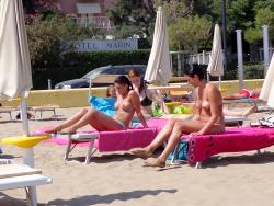 Girls sunbathing on italian beach of the adriatic coast 3/12