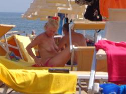 Girls sunbathing on italian beach of the adriatic coast 5/12