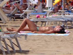Girls sunbathing on italian beach of the adriatic coast 8/12