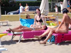 Girls sunbathing on italian beach of the adriatic coast 12/12