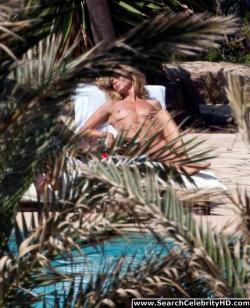 Heidi klum topless sunbathing candids in ibiza 12/12