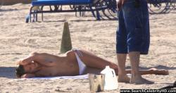 Anja rubik shows off her candid topless boobs at the beach 9/9