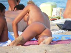 Tanned beach nudist 18/24