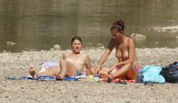 Topless nudist babes with tanga tanning in sun 3/18