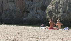 Topless nudist babes with tanga tanning in sun 14/18