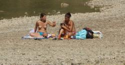 Topless nudist babes with tanga tanning in sun 18/18