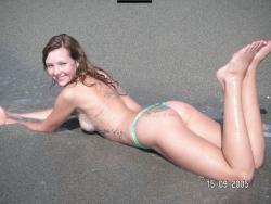 Brunette teen teasing on nude beach 37/46