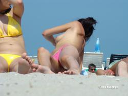 Topless girls on the beach - 204 53/55