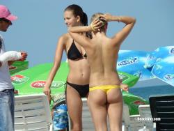 Topless girls on the beach - 114 49/49